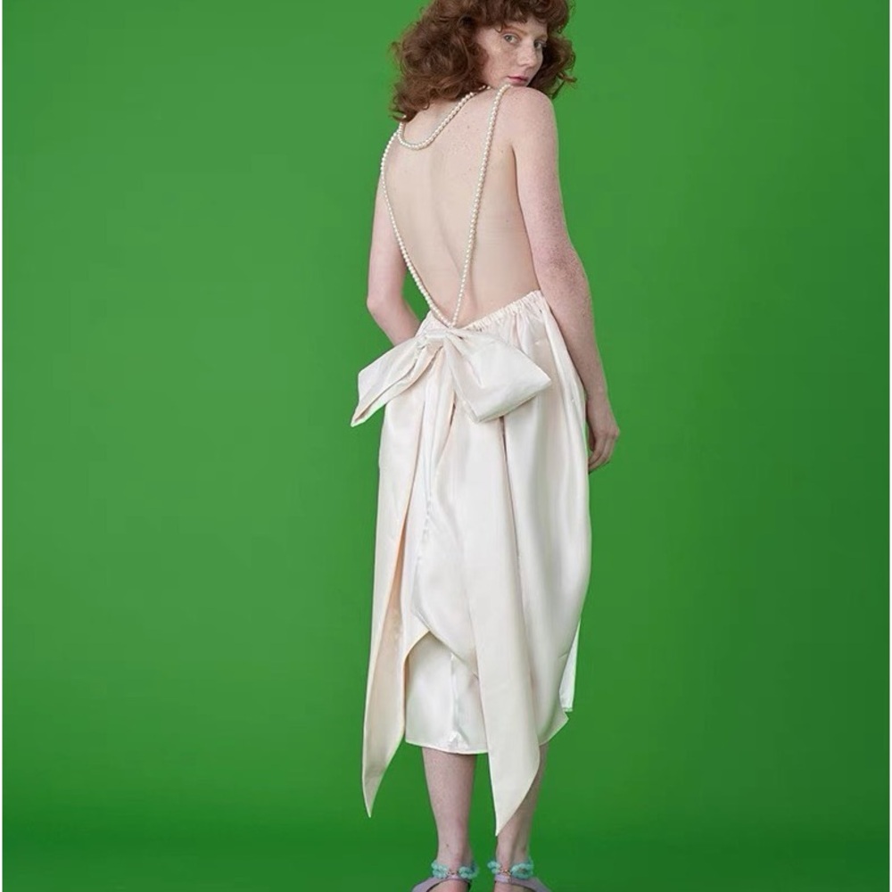 White satin midi dress with bow detail, pearl belt